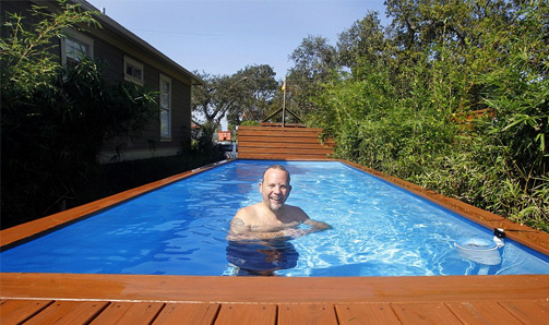 man swimming in pool